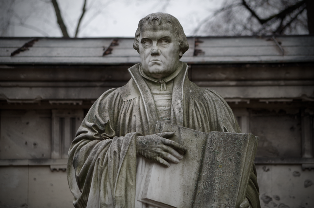 Close-up of the Martin Luther statue holding a book in Berlin, Germany. Voluntad
